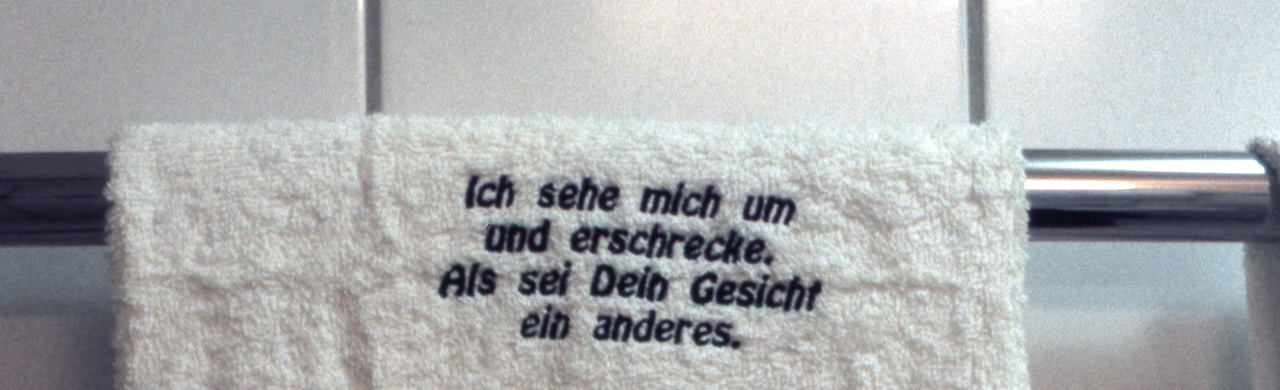 Side Effects, embroydered message on towel