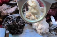 Magnifying glass and artefact  (photo credit Beth Kapusta)