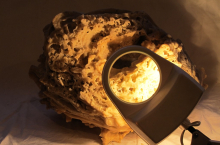 Magnifying lamp and artefact (photo credit Beth Kapusta)