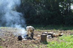 Casting bees-wax into caveties dug in a field in Hillier, 2009